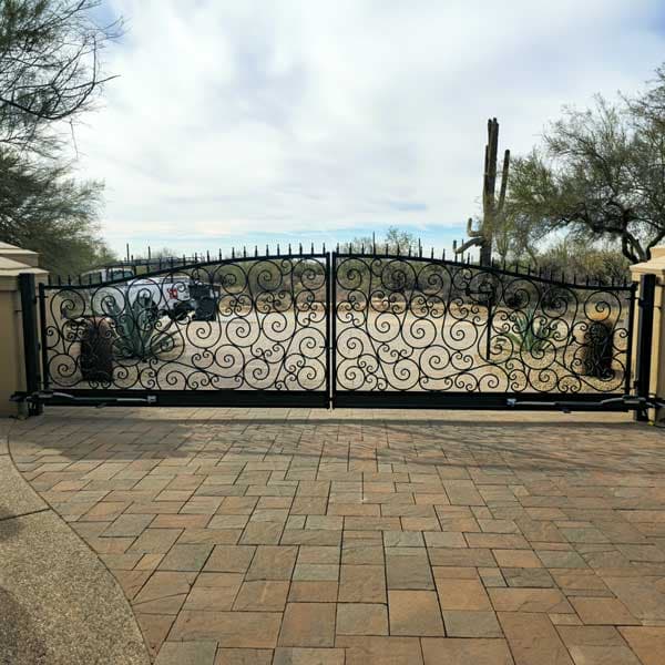 Modern iron driveway gate installation Scottsdale AZ with automated opener
